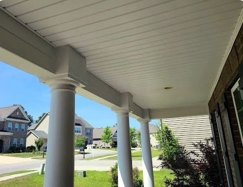 Covered residential entry with columns protected from recurring bird perching.